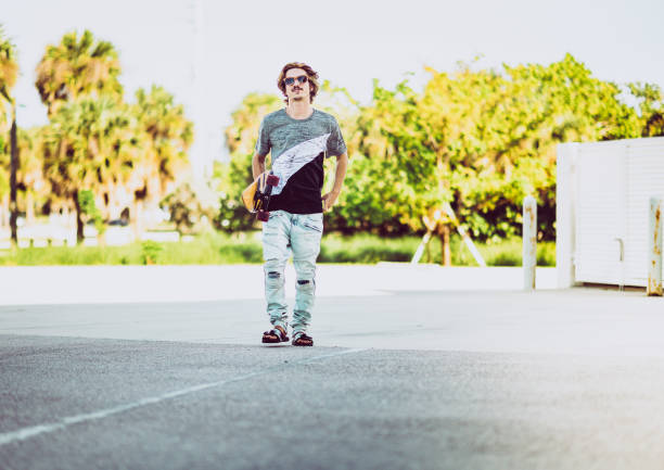 Man holding a skateboard