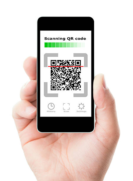 Smartphone in hand scanning QR code stock photo