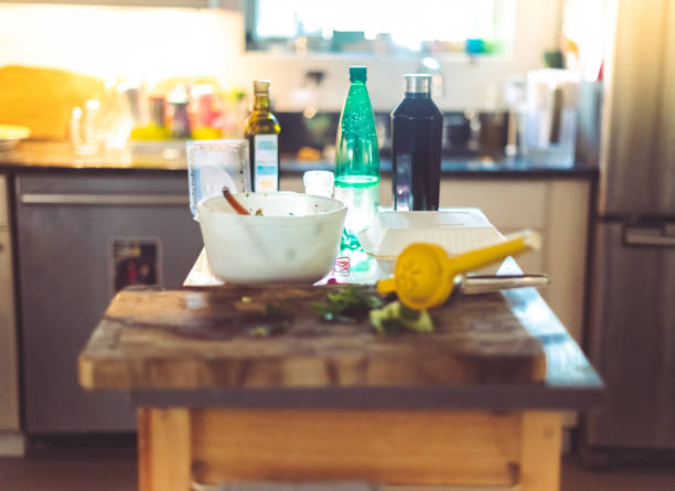 Stack of plates and bowls in sink