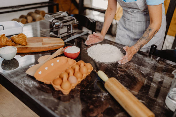 istock Woman making homemade pasta 1607812394