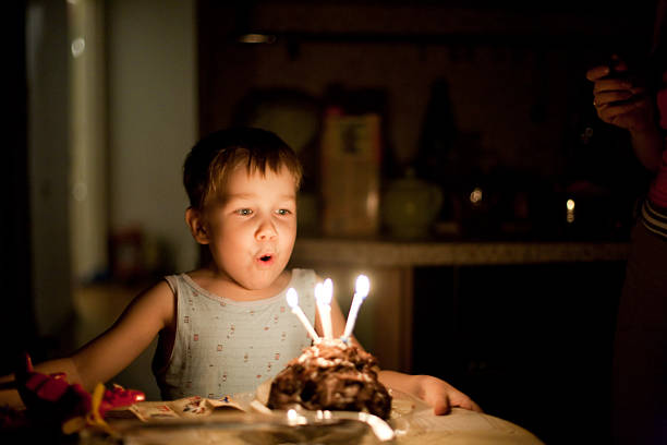 Father and Daughter in Front of Birthday Cake
