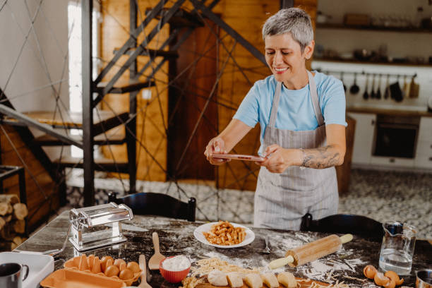 istock Woman making homemade pasta 1607844400