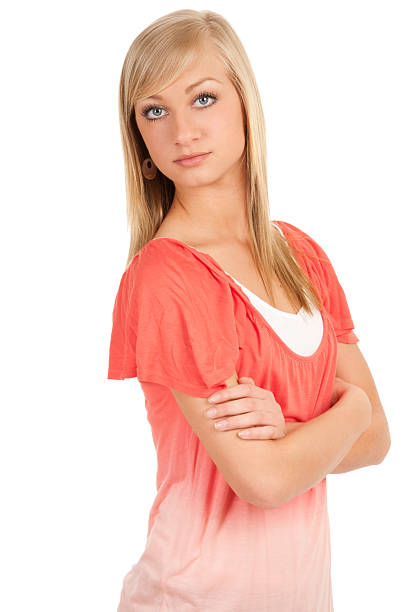 istock Beautiful Young woman standing with arms folded looking at camera 160789191