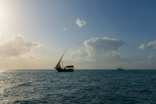 istock Silhouette of Dhow boat at sunny day 1607897074