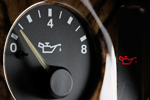 oil pressure gauge in car dashboard - low
