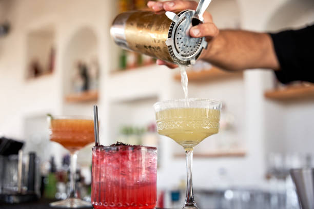 istock The bartender pours a margarita into the glass. 1607987458