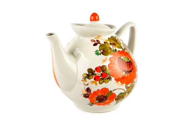 istock Large porcelain teapot with bright ornament isolated on white background. 1608032032