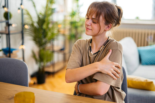 istock Young Woman Suffering From Stiff Shoulder 1608039434