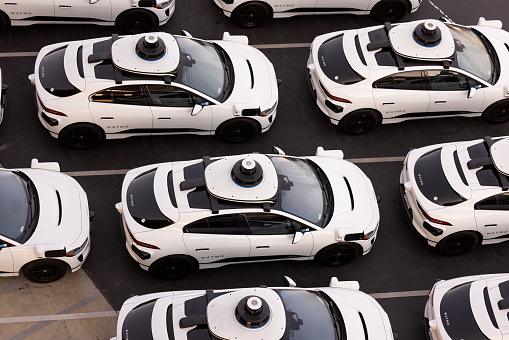 San Francisco, CA, USA - August 6, 2023:  Aerial view of Alphabet's Waymo self-driving car fleet storage facility in the Bayview Hunter's Point district just before the California Public Utilities Commission is set to vote  to allow Waymo and Cruise the ability to charge fares in San Francisco for complete driverless rides in the City.