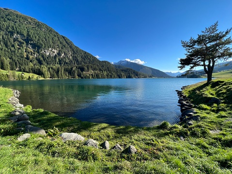 A famous Swiss mountain Lake Davos for sports and relaxation in the heart of the Alps (Davosersee oder Davoser See), Davos Dorf - Canton of Grisons, Switzerland (Kanton Graubünden, Schweiz)