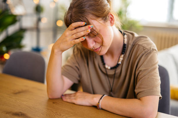 istock Stressed Young Woman Having A Headache 1608040958
