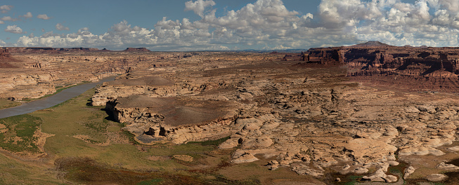 A broad panorama from this overlook provides a view of the Glen Canyon Dam Recreation Area, and in the distance, the Hite Crossing Bridge over the Colorado River in Utah.