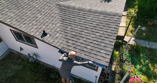 istock Senior man cleans roof gutter, overhead view 1608068253