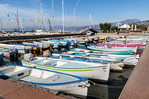 Colorful fishing boats at harbour of Bardolino