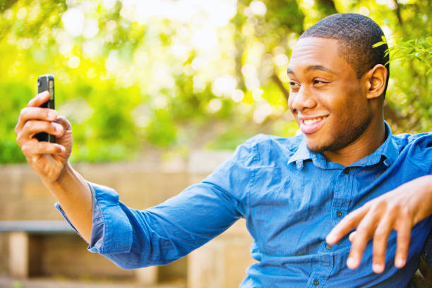 istock Happy Young Man Making Self-Portrait with mobile phone 160808734