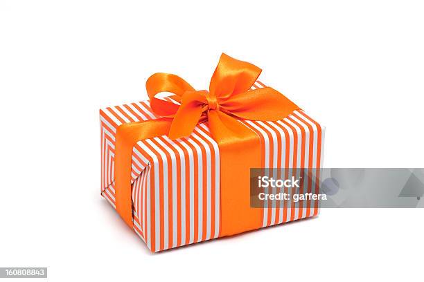 Gift Box Wrapped In Orange Stripped Paper With An Orange Bow 照片檔及更多 禮物 照片