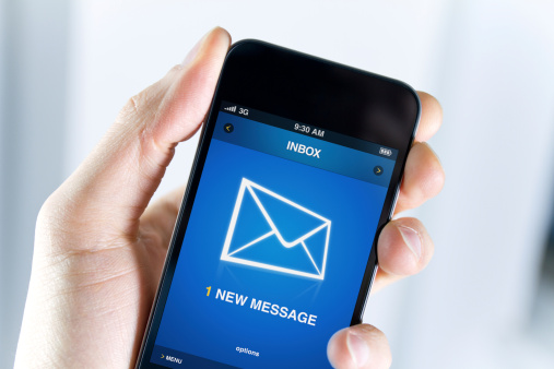 A man holding smartphone with one new message on a screen. Closeup shot.