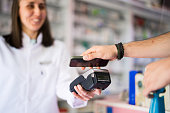 Customer making mobile payment at the pharmacy