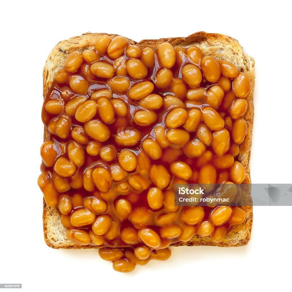 Baked Beans on Toast Isolated Baked beans on toast, isolated on white background.  Overhead view. Baked Beans Stock Photo