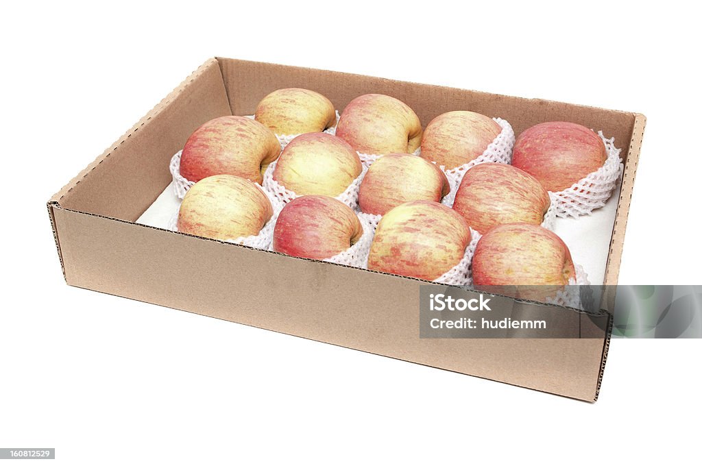 Apples isolated on white background Fresh apples in carton container isolated on white background. Apple - Fruit Stock Photo