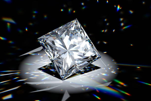 istock Princess cut diamond in spotlight with colorful refraction rays on black background 1608184644