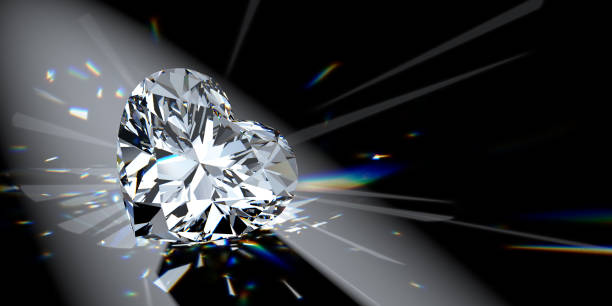 istock Heart cut diamond in spotlight with colorful refraction rays on black background 1608184979