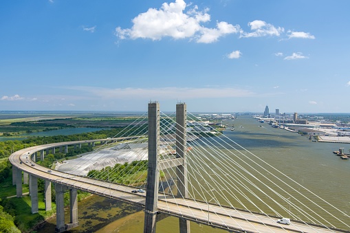 Aerial view of the Cochrane Africatown Bridge and the downtown Mobile, Alabama skyline