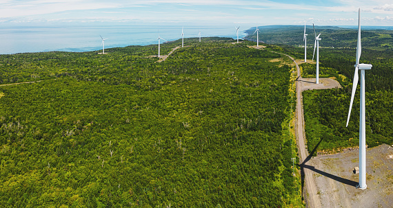Aerial drone view of a large public utility wind farm.