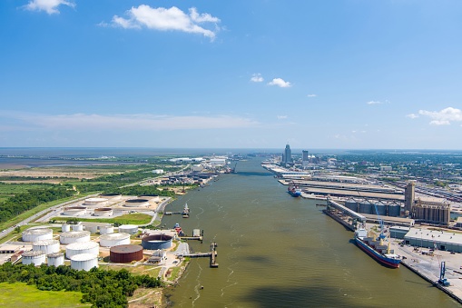 Aerial view of the downtown Mobile, Alabama skyline and the Mobile River on a summer day