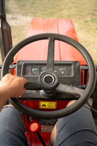 istock The farmer is driving a tractor in the garden. 1608214452