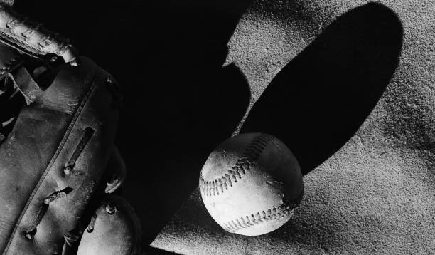 istock black and white image of baseball ball and glove 1608217177