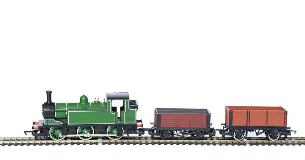 Toy Train with trucks Toy Train Set Green Train Pulling Wooden Wagons miniature train stock pictures, royalty-free photos & images