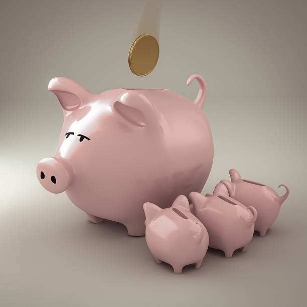 istock Piggy bank with puppies 160823478