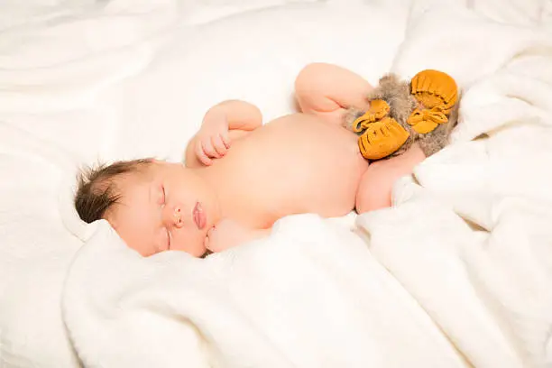 14 Day old Baby girl wearing Moccasin Slippers
