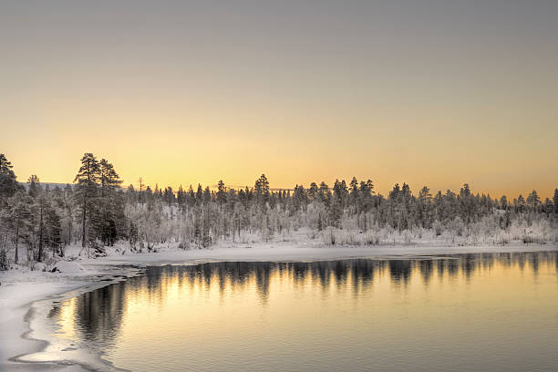 istock River flowing at sunset, nearby Inari, Finland 160824355