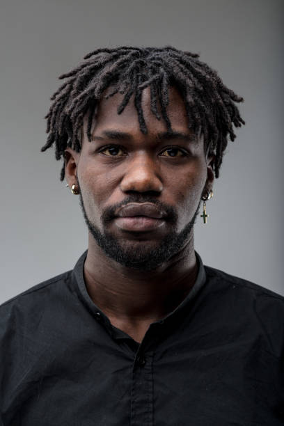 istock Man, short braids, gentle, complex, black shirt 1608278864