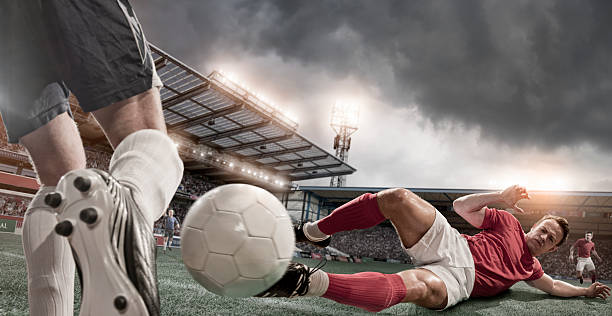 istock Soccer Player in Sliding Tackle 160829682