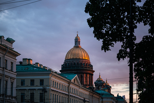 Saint Isaac's Cathedral Dome against dramatic sky at sunset. Saint-Petersburg, Russia
