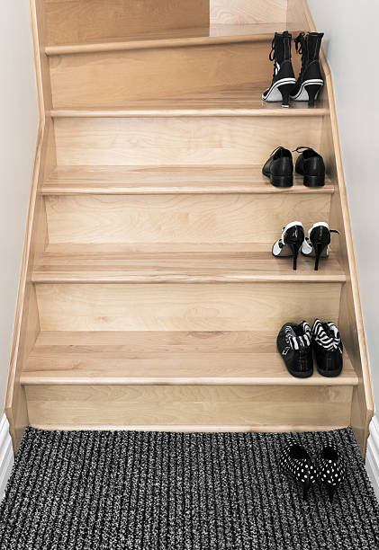 istock Shoes on a wooden staircase 160830817