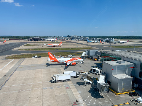 London, UK - June, 14th, 2023: A view of an Easyjet aircraft parked at its Gate at Gatwick Airport in Surrey. UK.  Easyjet is a budget British airline carrier.