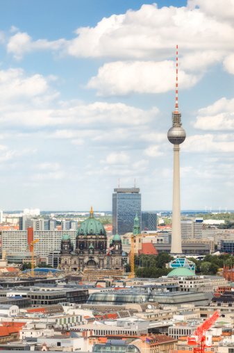 A bird's eye view of the Berlin Cathedral and TV Tower on a clear sunny day.