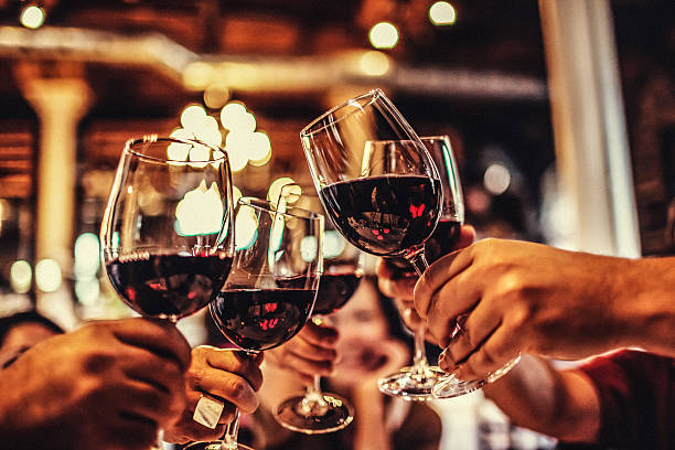 Celebration Five friends cheering on good news. red wine stock pictures, royalty-free photos & images