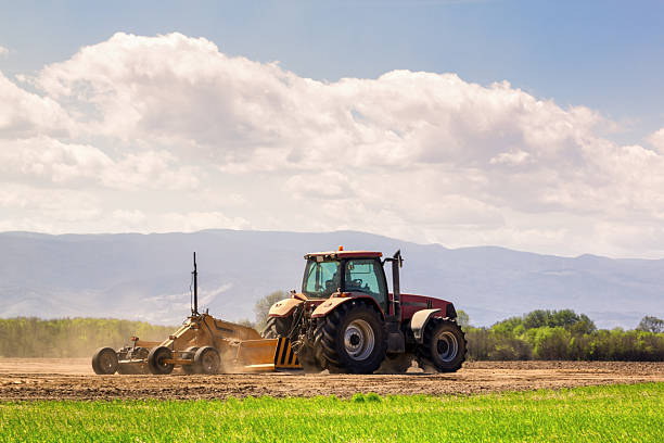 istock Tractor and laser guided land leveler 160840630