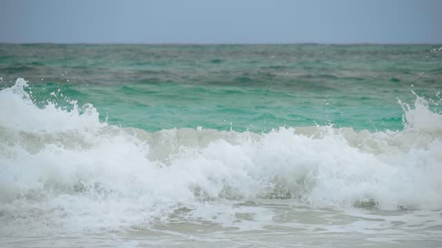 Closeup with slow motion sea splash waves.