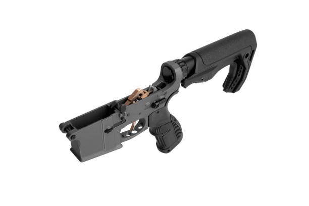 AR15 lower receiver iand buffer spring. Bottom half of a modern assault rifle. Isolate on white background.