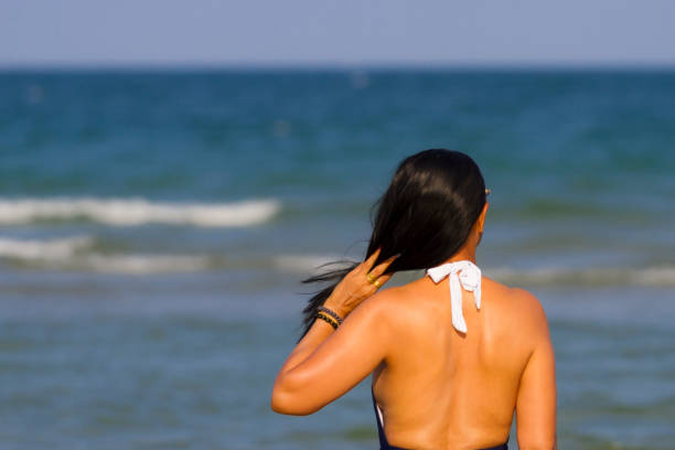 istock Woman body beautiful with bikini relax on beach 1608459638
