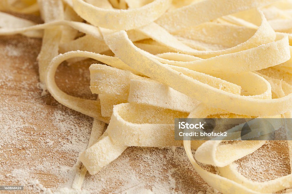 Fresh Homemade Pasta Fresh Homemade Pasta against a background Carbohydrate - Food Type Stock Photo