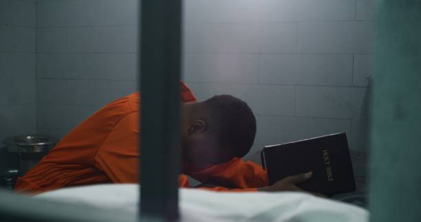 istock Religious African American prisoner prays to God 1608533632