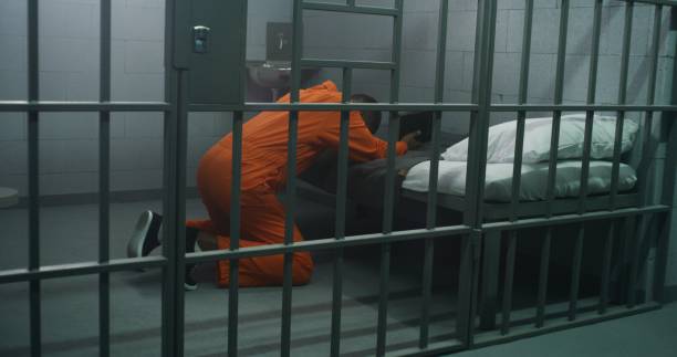 istock Religious African American prisoner prays to God 1608536244