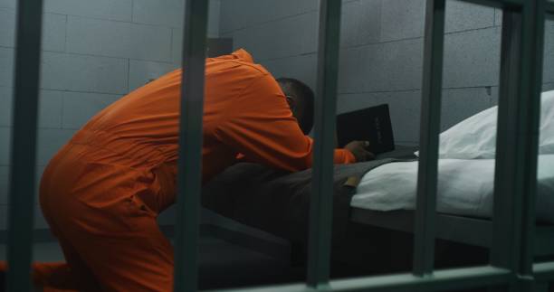 istock Religious African American prisoner prays to God 1608537382